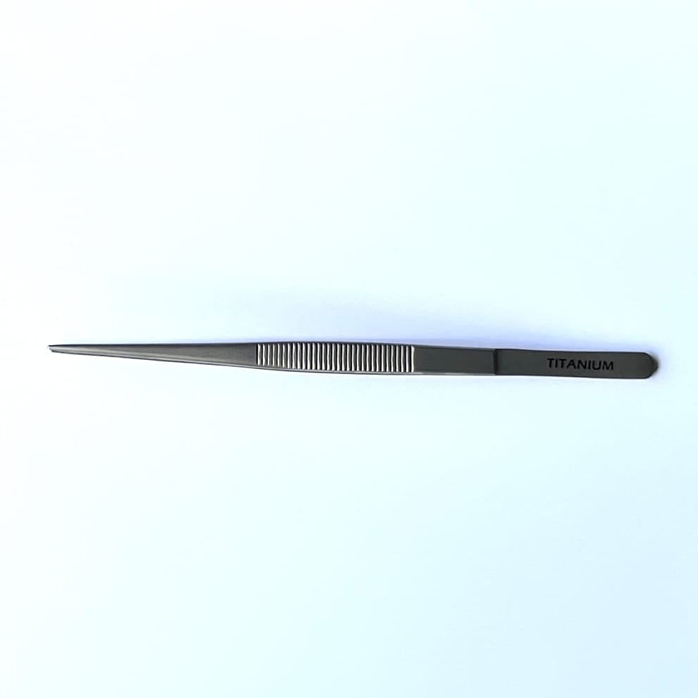 long Titanium tweezers with medium fine serrated tips and serrated handle 